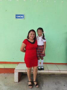 back to school, Woman with Her Little Daughter in a School Uniform